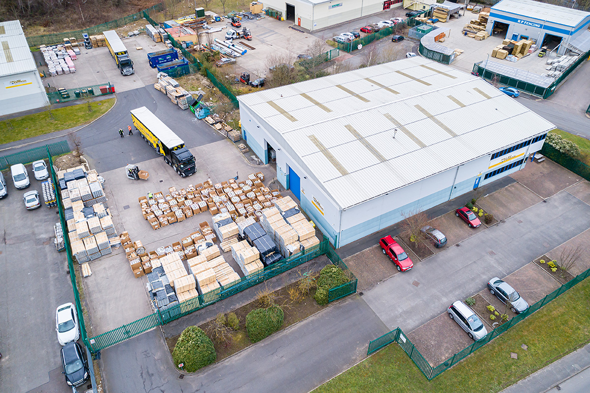  Drone photo of stacked timber and warehouse facility at Meter Provida 